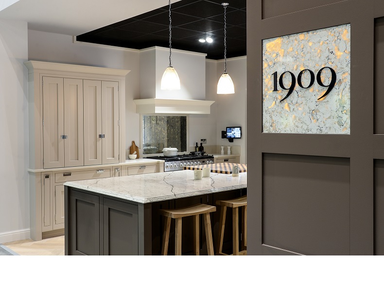 A 1909 kitchen showroom, showcasing a shaker kitchen with marble worktops.